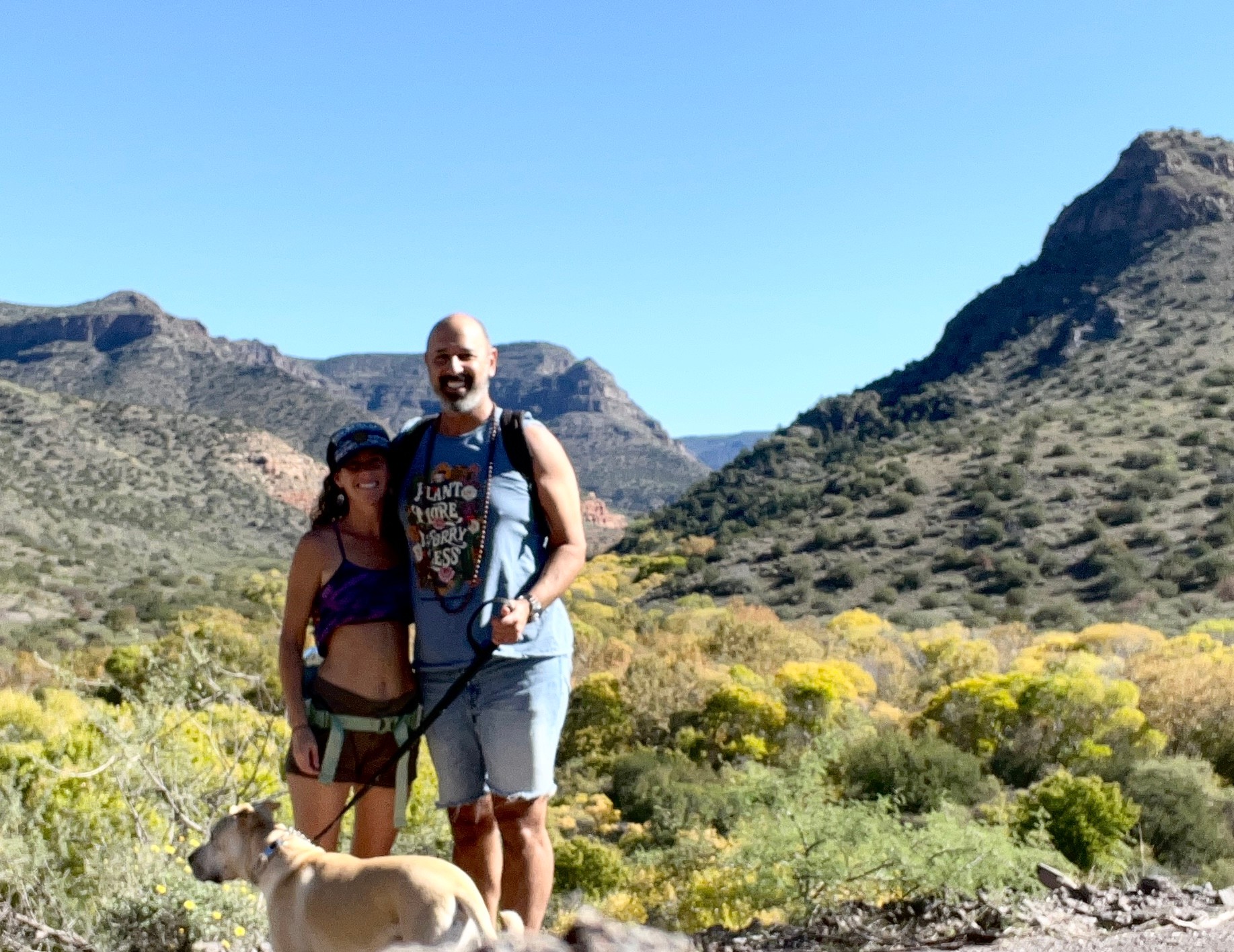 Vivian and Hamid Jabbar with their dog Babaji in the desert mountains